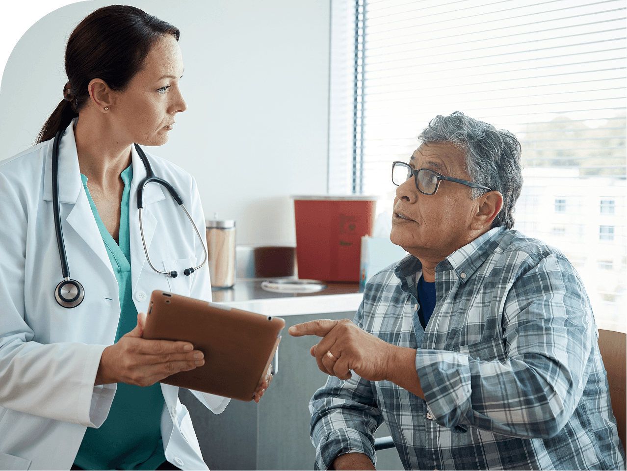 Healthcare provider speaking with a patient