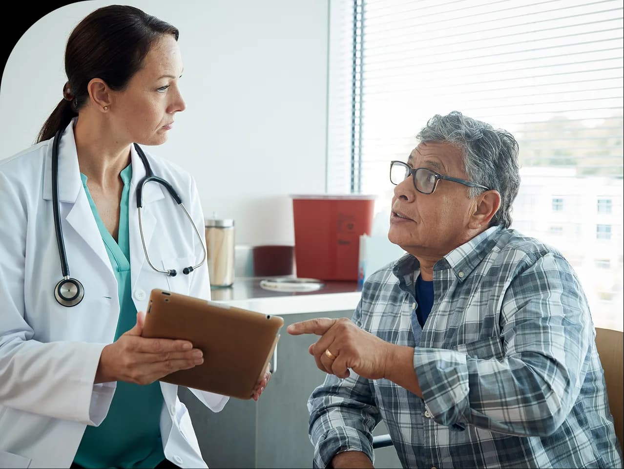 Healthcare provider speaking with a patient